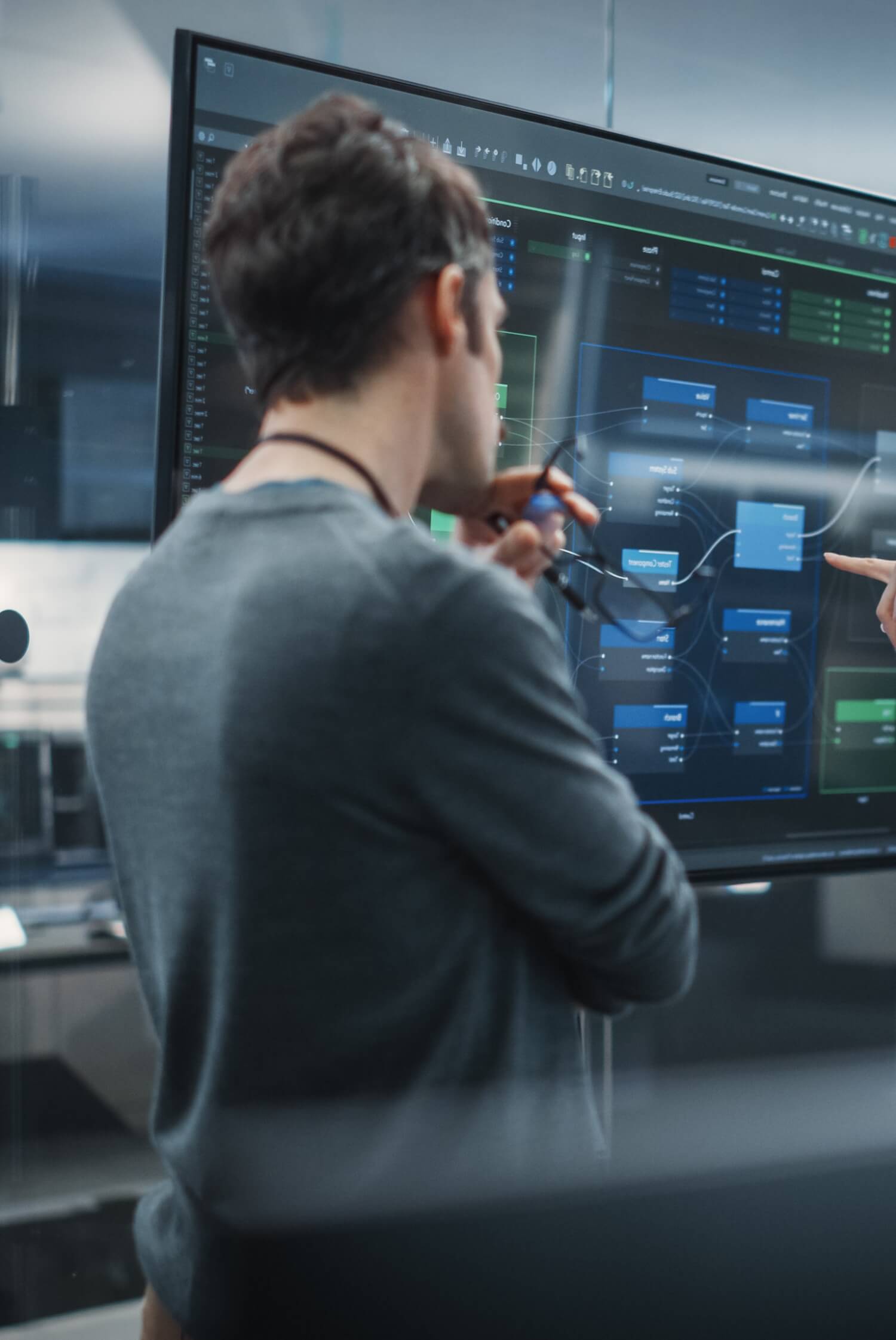 A developer looks at process data on a screen